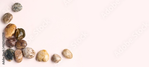 Many pebbles on light backg...