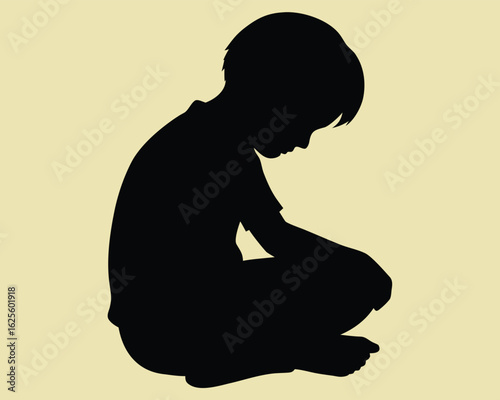 Lonely boy silhouette contemplating life sitting down, feeling sad or thoughtful