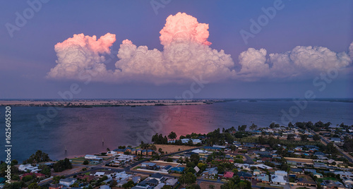 Yarrawonga glows beneath towering cumulus clouds