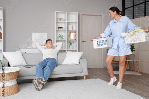 Wife with laundry baskets a...