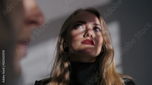 Wallpaper Mural Close-up portrait of a woman, with a blurred figure in the foreground, suggesting a conversation or interaction. Torontodigital.ca