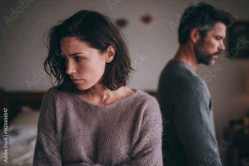 Tension in the Room: Unhappy Couple Facing Relationship Struggles