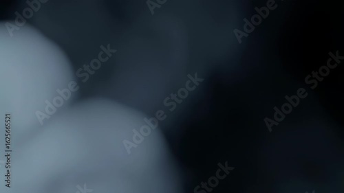 Ethereal Smoke Swirls: Abstract Motion of Fog and Mist on Dark Background