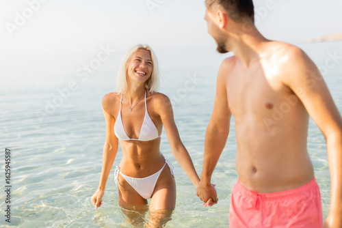 Joyful couple enjoying a su...