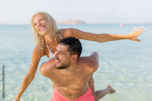 Joyful couple enjoying a pl...
