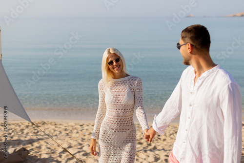 Blissful beach stroll at su...