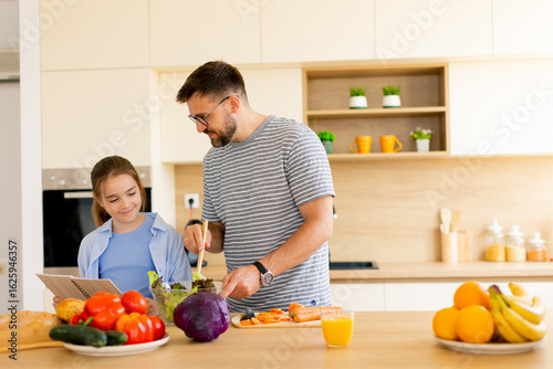Father and daughter cooking...