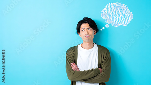 Man with thought bubble looking confused thinking blue background