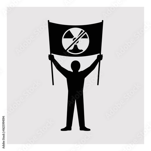 Silhouette of person holding a banner with no radiation symbol signifying anti nuclear movement and environmental advocacy