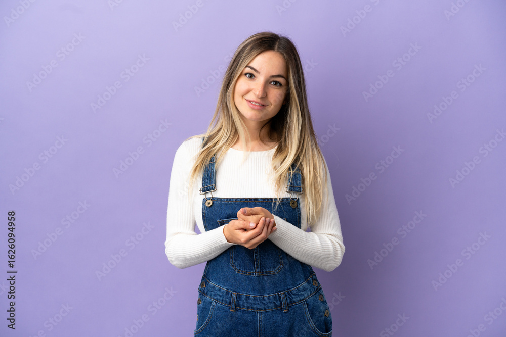 Young woman over isolated purple background laughing Young woman over isolated purple background laughing