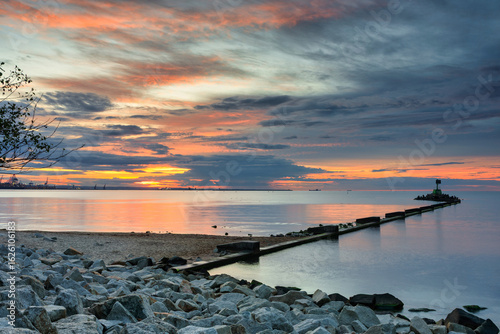 Fototapeta Naklejka Na Ścianę i Meble -  Sunset over the Baltic Sea beach in Gorki Zachodnie, Gdansk. Poland