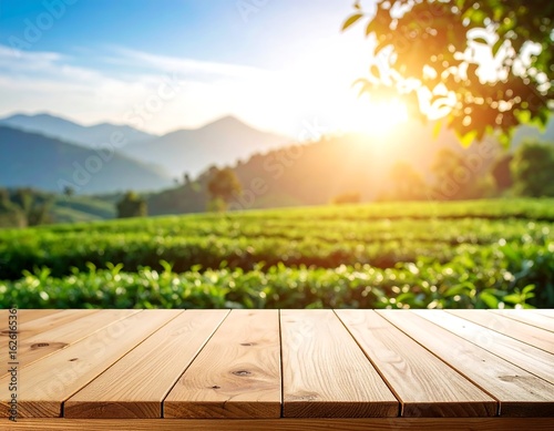 Wooden table in front of a sunlit tea plantation