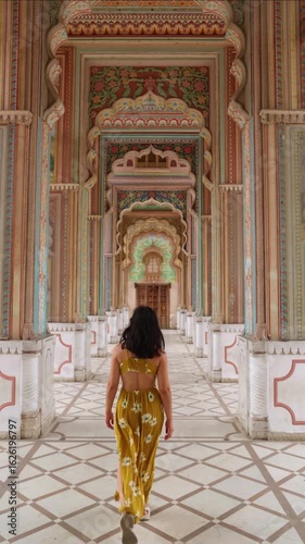 vertical Tourist walking in Jaipur City Palace, India