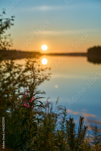 beautiful sunset at a lake in Finland in midsummer.
