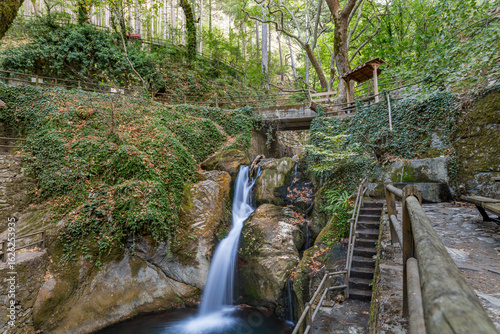 Generated imageSmall waterfall surrounded by lush greenery and rocky landscape in Ayazma Nature Park, foothills of Mount Ida, Bayramiç, Çanakkale, Turkey