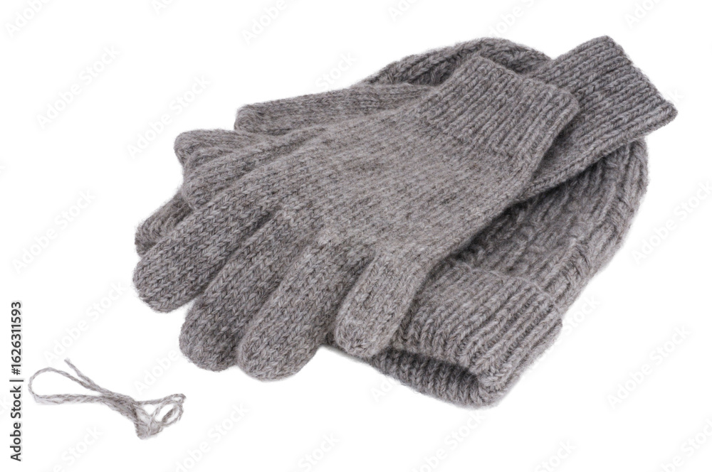 Fototapeta premium Gray wool gloves and hat isolated on white background. Gray wool gloves.