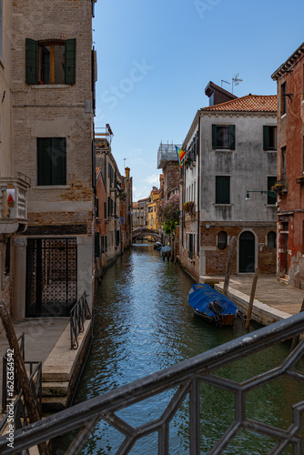 A photo of a canal with boats