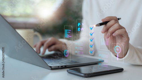 Canvas Print Hand using a digital checklist interface with charts and AI icons on a laptop
