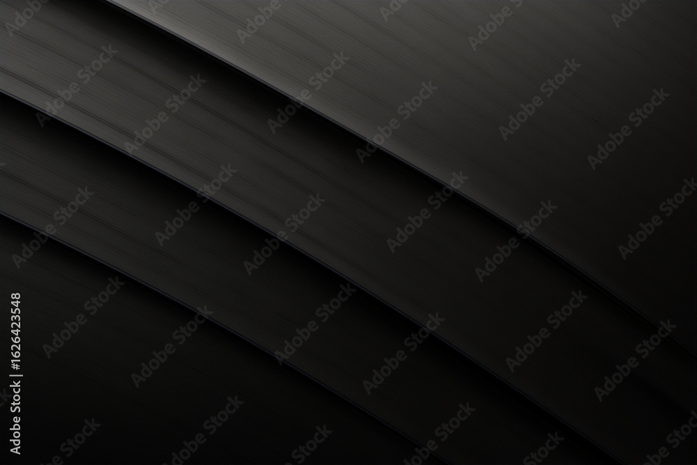 Obraz premium Dark, sleek curves of black material creating a modern and minimal abstract background with elegant texture.