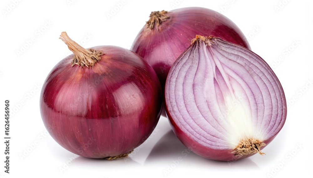 Fototapeta premium Purple onion layers on gray countertop. Onion stem points up, leaves down. Outer layer dark purple, inner layer vibrant purple. Whole onion sliced into three parts