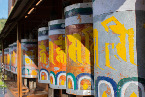Quadro em tela Prayer wheels, or mani wheels, cylindrical wheels for Buddhist recitation