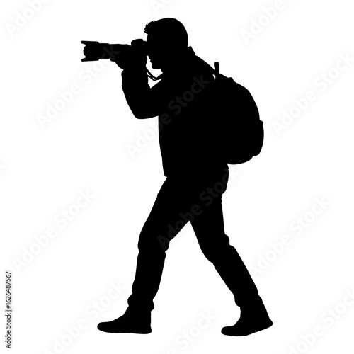 Photographer silhouette with backpack taking picture