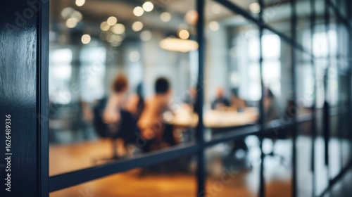 Blurred scene of individuals gathered in a conference room, emphasizing anonymity and obscurity - Obscurity