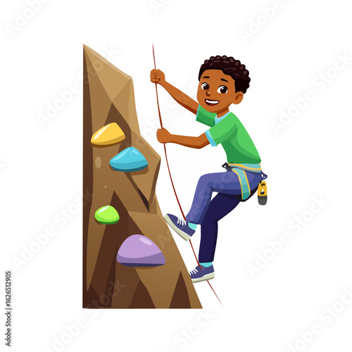 Boy rock climbing indoors. Young athlete in safety harness climbing an artificial wall with colorful grips and rope.