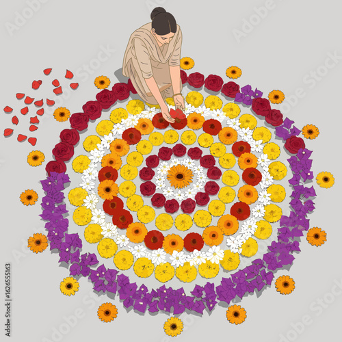 Woman creating intricate floral rangoli pattern with vibrant gerbera daisies and marigolds on grey background