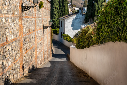 Streets and old buildings of Granada in Andalusia (Spain). El Albaicin (or Albayzin). View of the streets and old buildings of Granada historic city of Andalusia (Spain).