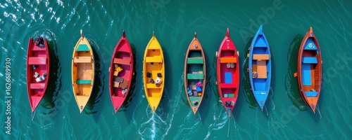 Colorful Boats Aligned on Calm Water Surface Captivating Aerial View