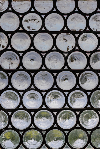 Circles of convex glass in window create interesting background element