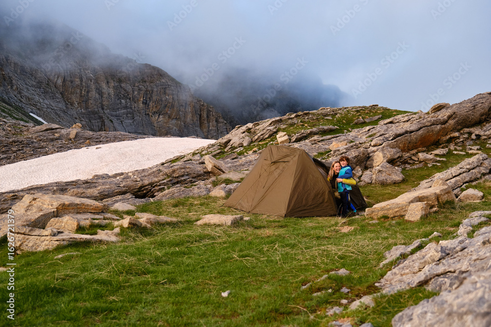Fototapeta premium Mother and son camping in nature