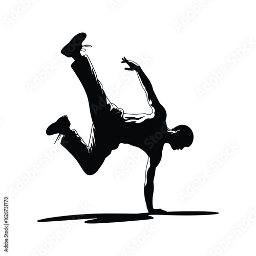 Silhouette of a breakdancer performing a dynamic freeze on one hand