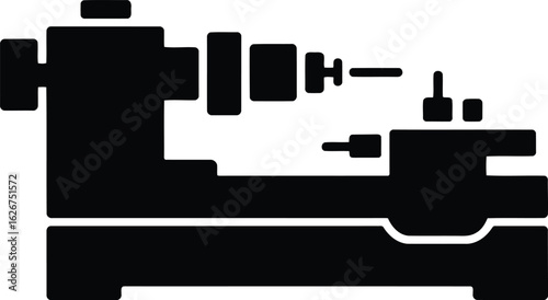 Black silhouette of a metalworking lathe machine industrial