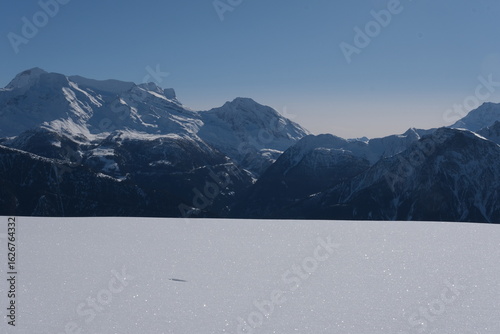 Majestic Snow-Capped Mountains Under Blue Sky