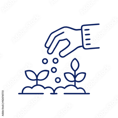 Hand planting seeds into soil near young sprouting plants  