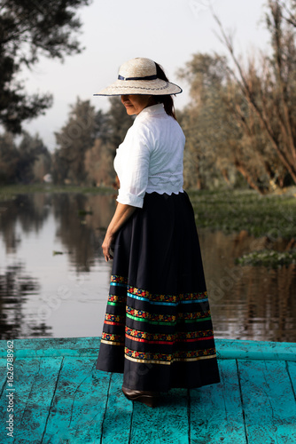 Woman in traditional attire in Xochimilco, Mexico