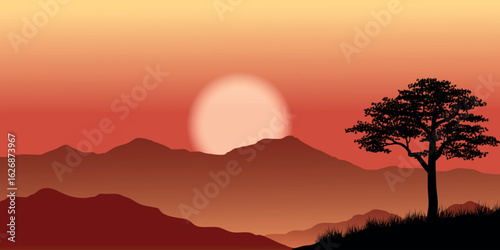 sunset over a mountainous landscape. The silhouette of a lone tree can be seen in the foreground, and the mountains have several layers in shades of brown and red.