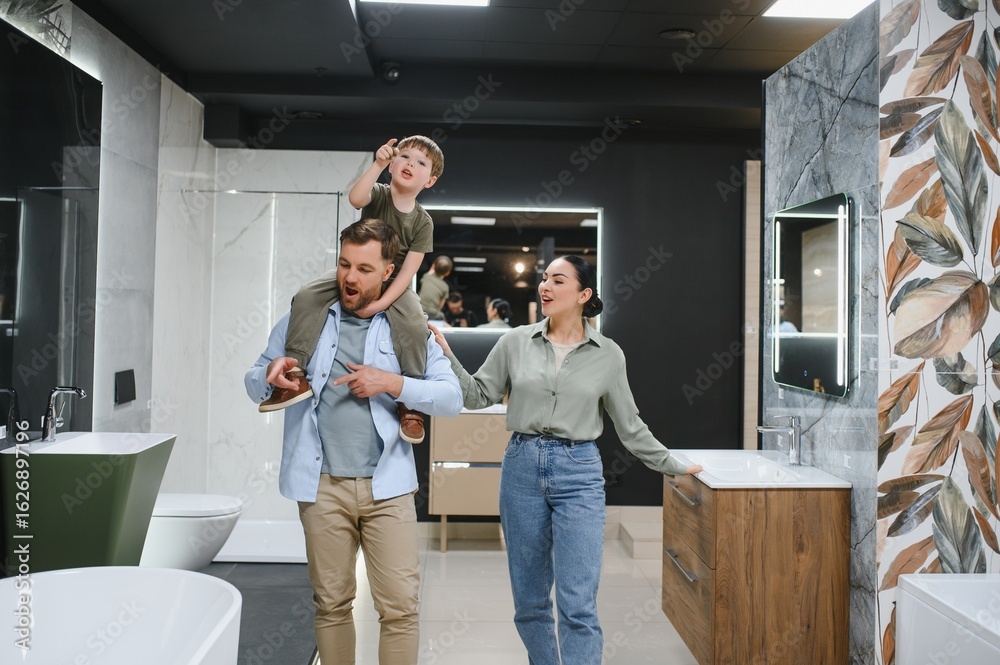 Obraz premium Family choosing bathroom fixtures in plumbing store