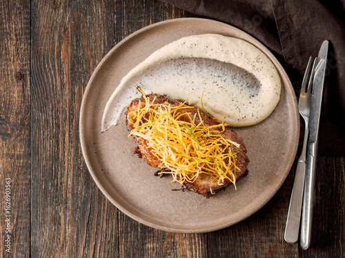 Obraz na plátne Beef or pork steak with shoestring fries onion and potatoes puree