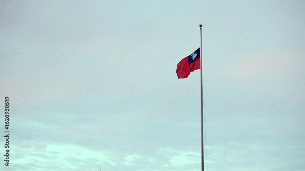 Slow motion of officers folding the Taiwan flag at sunset as part of a ceremonial procedure. The scene captures respect and patriotism in Taiwan.