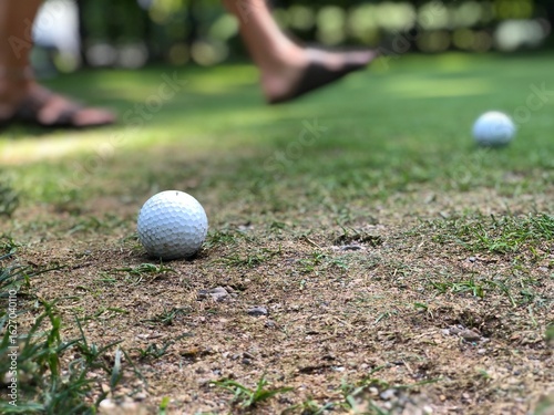 Golf Practice on Summer Turf Someone Walking in View