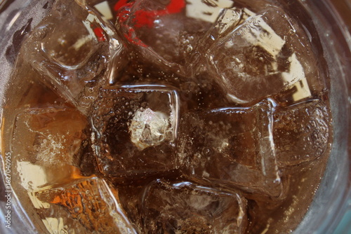 Close-Up of Ice Cubes and Cola Drink