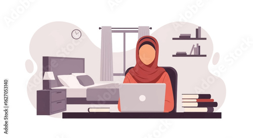A young woman wearing a hijab is working from home on her laptop, sitting at a desk with books, in a bedroom with a bed in the background.