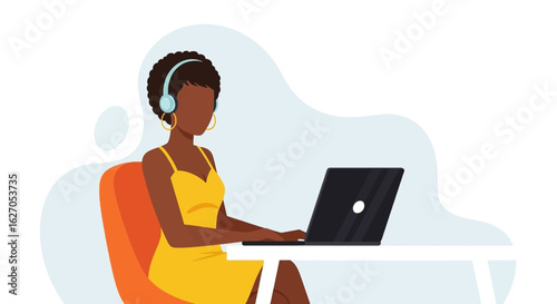 A stylish African American woman wearing headphones is diligently working on her laptop, embodying modern remote work and digital productivity.