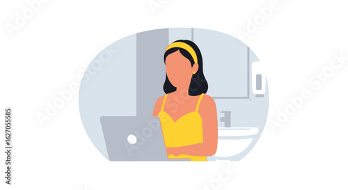 A young woman with dark hair and a yellow top is working on a laptop in a modern, minimalist bathroom setting, focused on her task.