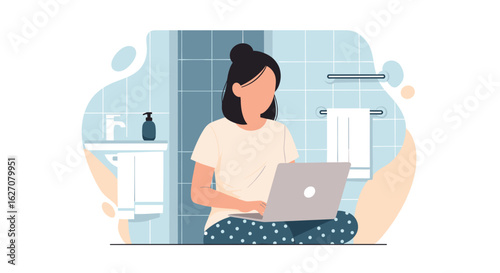 Woman in pajamas working on a laptop in a modern bathroom, illustrating flexible remote work and comfortable home lifestyle.