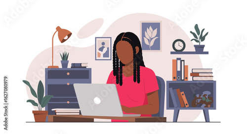 Young Black woman working on laptop in cozy home office. Represents remote work, online education, and modern productivity. Ideal for business, lifestyle, and technology concepts.
