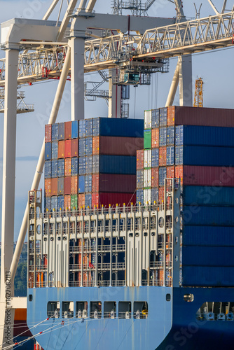 Large Cargo Ship With Stacked Containers Docked at a Port in Koper Slovenia